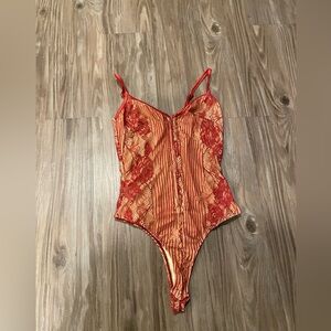 Lulu’s red lace body suit